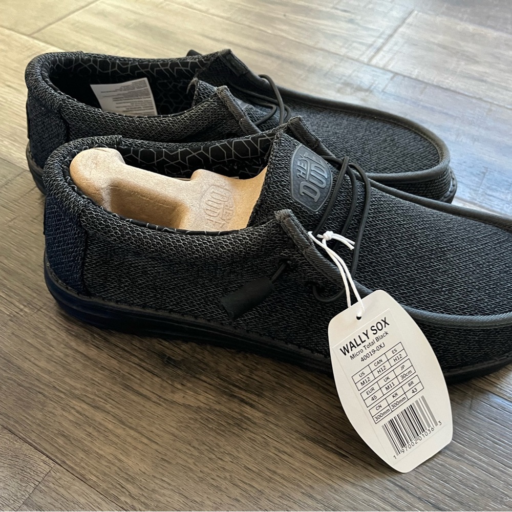 Brand new men’s black dudes size 12